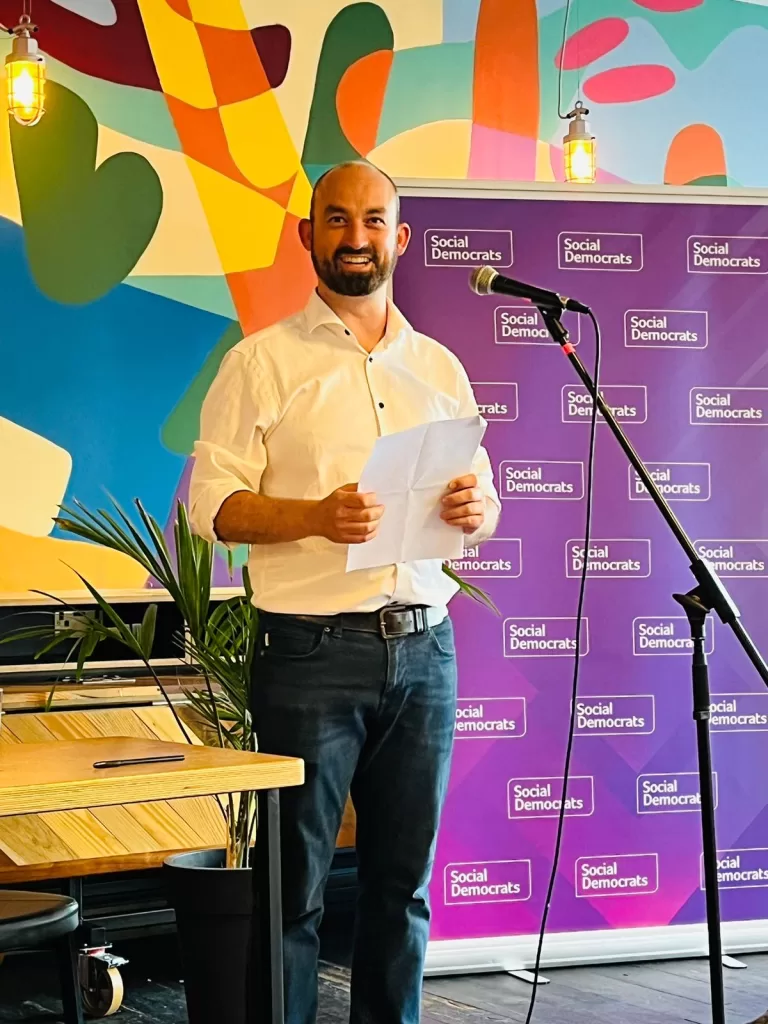 Eoin giving a speech at his selection convention in July at the Tara Buildings in Dublin, smiling at the photographer.